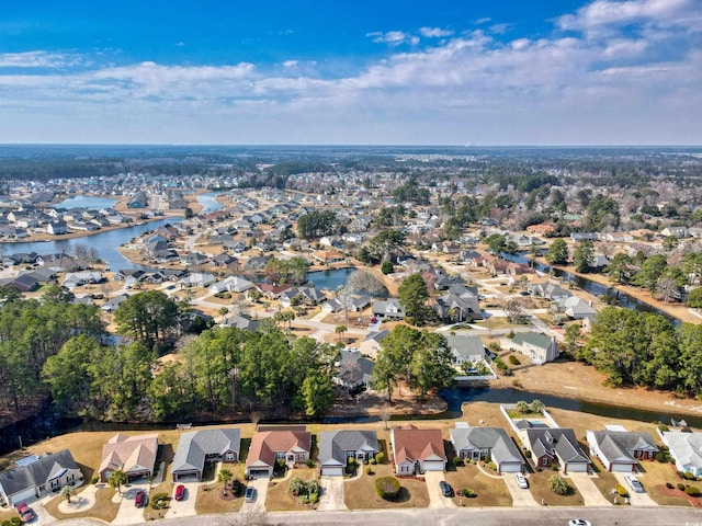 drone / aerial view with a residential view and a water view