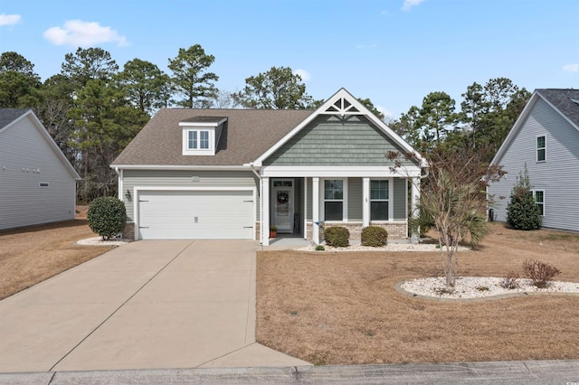 view of front of home featuring a garage, a porch, concrete driveway, and roof with shingles