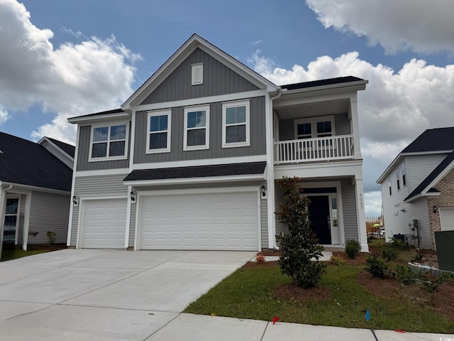 4043 Bucolic Loop, Myrtle Beach, SC 29588 - view of front of property featuring board and batten siding, a garage, a balcony, and driveway