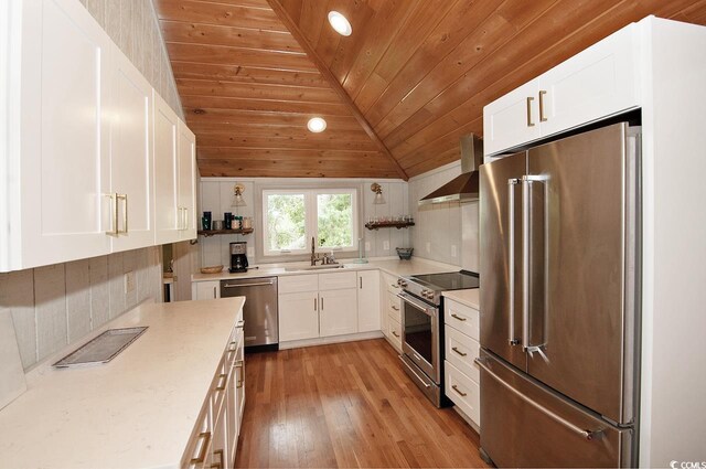 kitchen with vaulted ceiling, light wood-style flooring, white cabinets, and open shelves