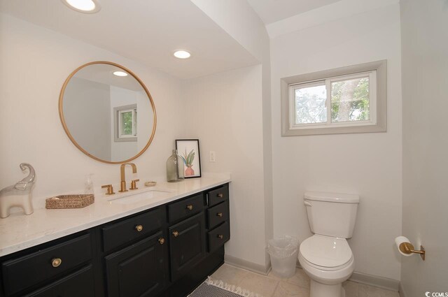 half bath with baseboards, toilet, recessed lighting, tile patterned floors, and vanity