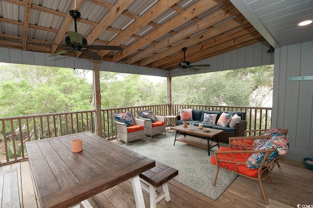 wooden terrace featuring ceiling fan and outdoor lounge area