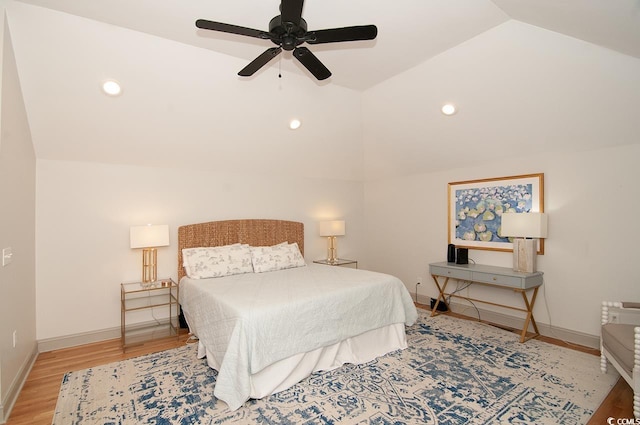 bedroom featuring a ceiling fan, wood finished floors, baseboards, recessed lighting, and vaulted ceiling