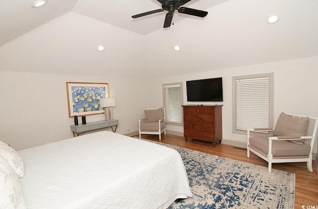 bedroom featuring a ceiling fan, lofted ceiling, wood finished floors, and recessed lighting