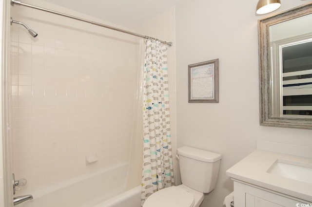 bathroom with vanity, toilet, and shower / tub combo with curtain