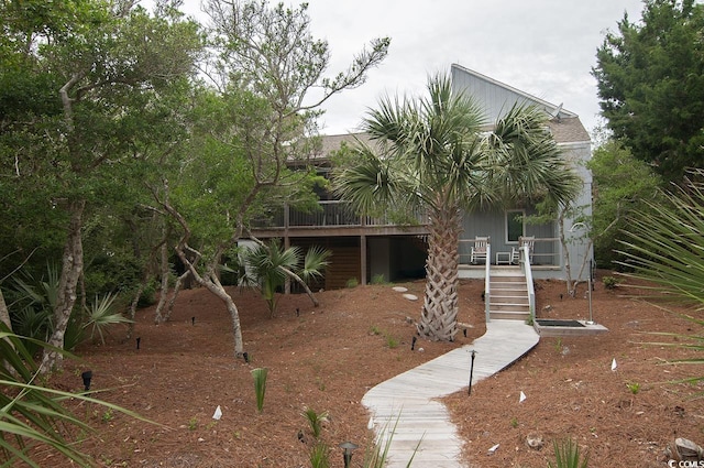 view of front of house featuring stairway