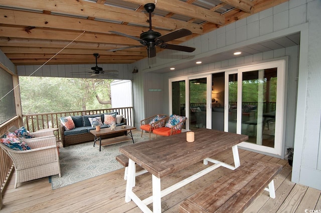 deck featuring a ceiling fan and an outdoor hangout area