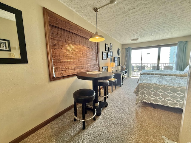 carpeted bedroom featuring visible vents, a textured wall, a textured ceiling, access to outside, and baseboards