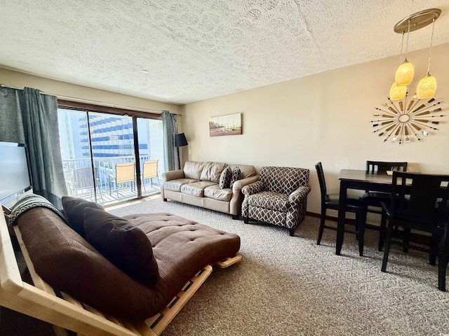 carpeted living area with a textured ceiling