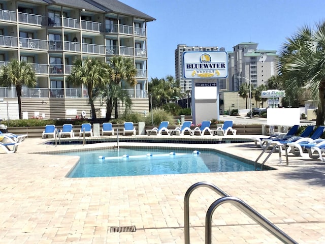 community pool featuring a patio area