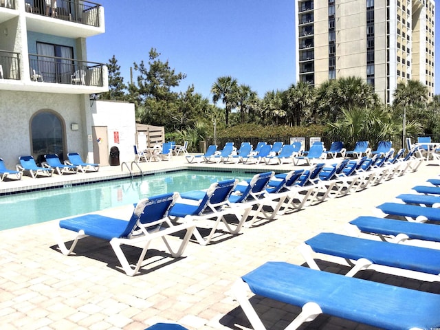 community pool with a patio