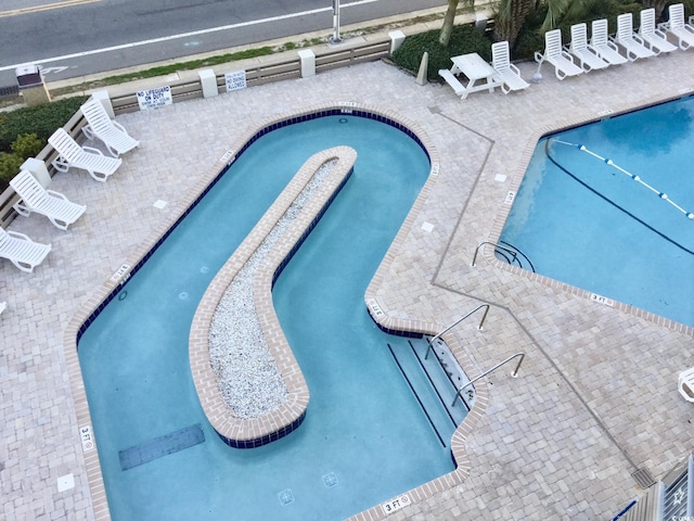 pool with a patio