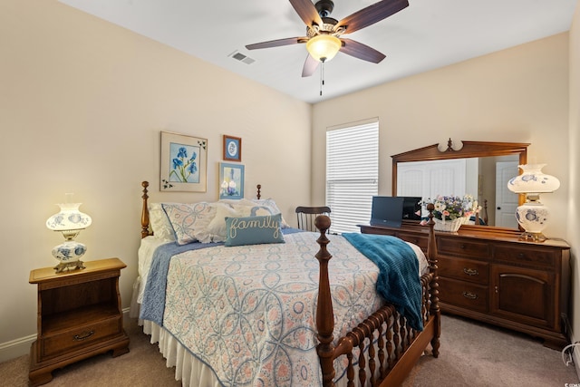 bedroom featuring light carpet, ceiling fan, and visible vents