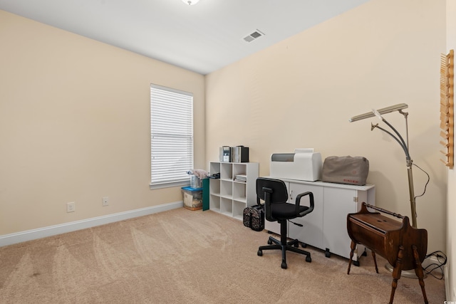 office area featuring baseboards, visible vents, and carpet flooring