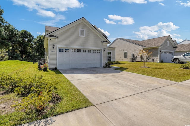 view of front facade with a garage, a front yard, and concrete driveway