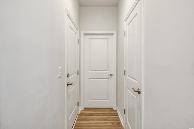 doorway to outside with light wood-style flooring