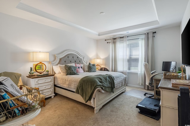 bedroom with light carpet, a tray ceiling, and crown molding