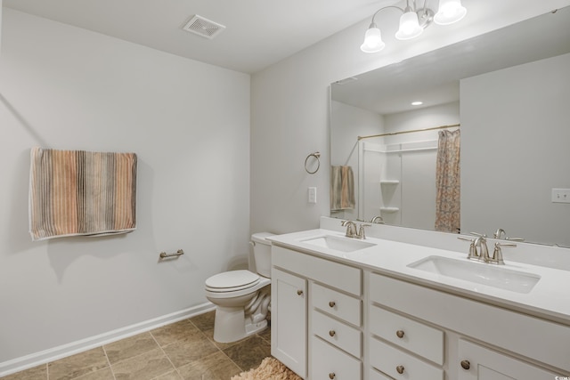 bathroom featuring visible vents, a sink, toilet, and double vanity