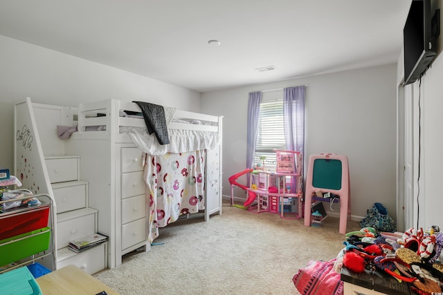 bedroom featuring carpet floors and visible vents