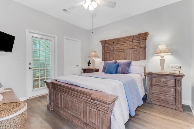 bedroom featuring visible vents, baseboards, a ceiling fan, and light wood finished floors