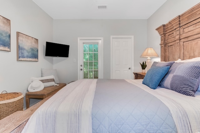 bedroom featuring visible vents and access to exterior