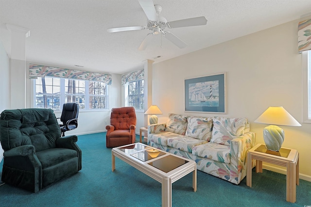 carpeted living room with a ceiling fan, visible vents, baseboards, and a textured ceiling