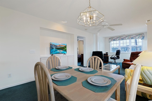 carpeted dining area with ceiling fan with notable chandelier and baseboards