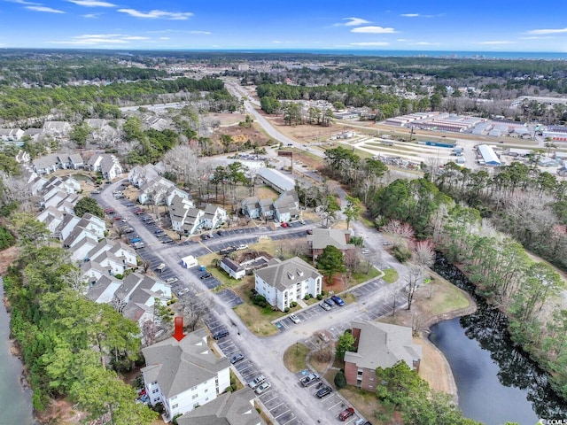 birds eye view of property featuring a water view and a residential view