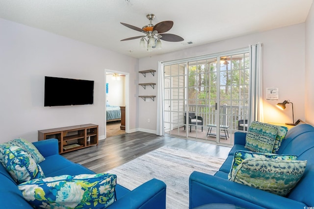 5801 Oyster Catcher Dr Unit 724, North Myrtle Beach, SC 29582 - living room with a ceiling fan, wood finished floors, and baseboards