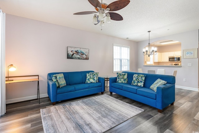 5801 Oyster Catcher Dr Unit 724, North Myrtle Beach, SC 29582 - living room with wood finished floors, ceiling fan, baseboards, a chandelier, and a textured ceiling