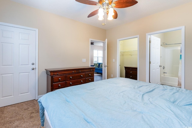 5801 Oyster Catcher Dr Unit 724, North Myrtle Beach, SC 29582 - carpeted bedroom featuring a spacious closet, connected bathroom, a closet, and ceiling fan