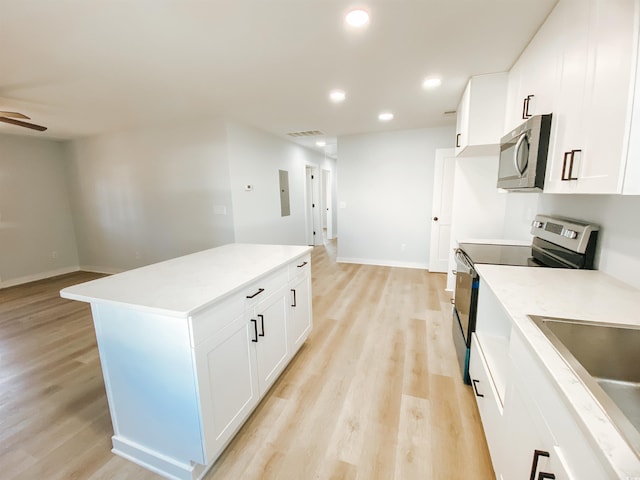 kitchen with stainless steel appliances, light wood-style flooring, visible vents, and recessed lighting