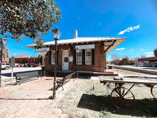 exterior space with brick siding