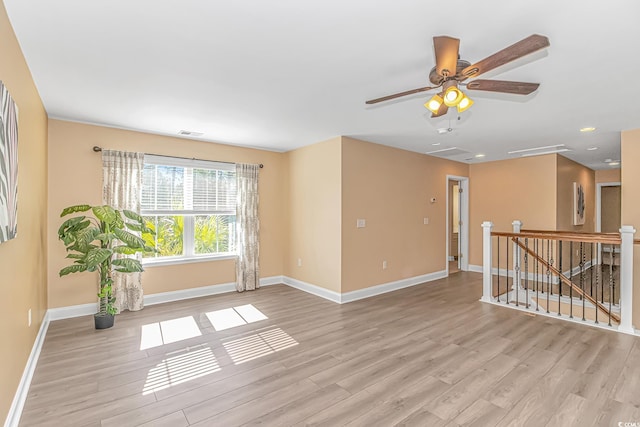 unfurnished room with recessed lighting, visible vents, ceiling fan, light wood-type flooring, and baseboards