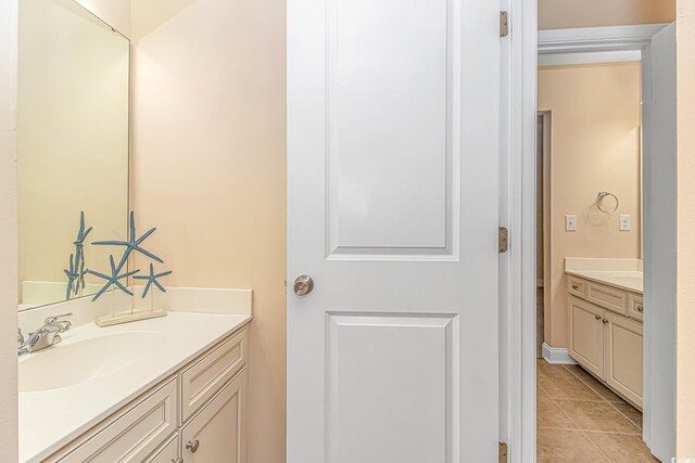 bathroom with vanity and tile patterned floors