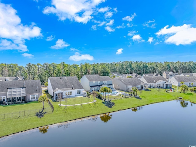 birds eye view of property with a water view and a residential view