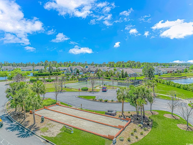 birds eye view of property featuring a water view and a residential view