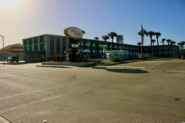 view of property with uncovered parking