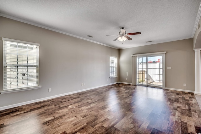 unfurnished room featuring crown molding, a textured ceiling, dark wood-type flooring, and a ceiling fan