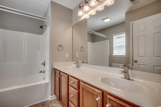 bathroom featuring visible vents, tub / shower combination, toilet, and a sink