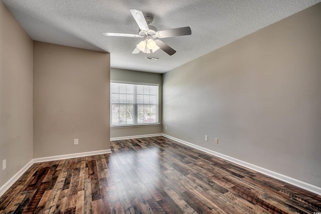 unfurnished room with baseboards, a textured ceiling, dark wood finished floors, and a ceiling fan