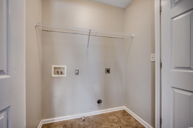 clothes washing area with laundry area, electric dryer hookup, baseboards, and washer hookup