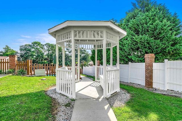 exterior space featuring a gazebo and a fenced backyard