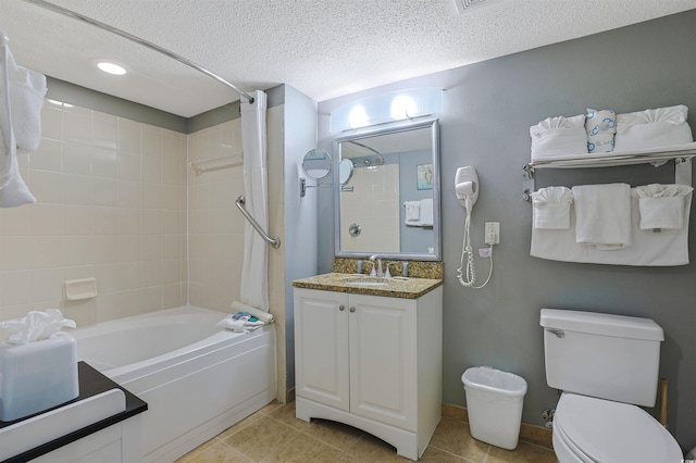 full bath featuring toilet, shower / tub combo with curtain, tile patterned flooring, a textured ceiling, and vanity