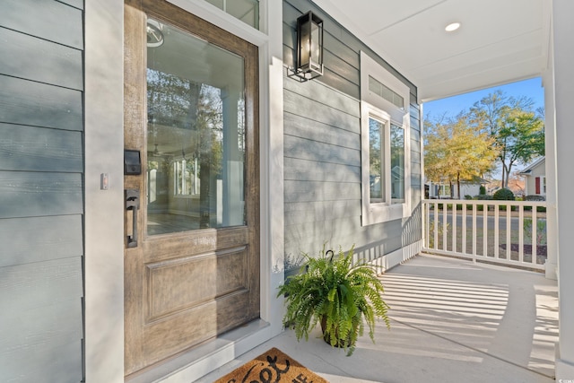 entrance to property featuring a porch