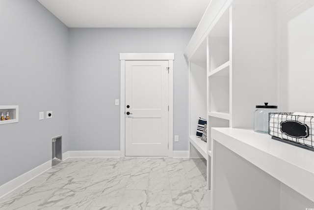 washroom with hookup for a washing machine, laundry area, baseboards, marble finish floor, and electric dryer hookup