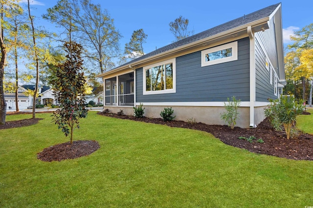 view of property exterior with a sunroom and a lawn