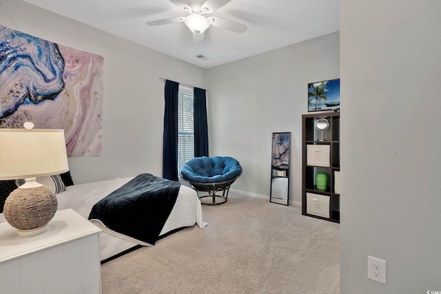 carpeted bedroom featuring visible vents, ceiling fan, and baseboards