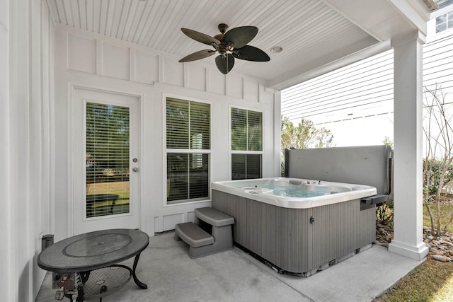 view of patio / terrace with a ceiling fan and a hot tub