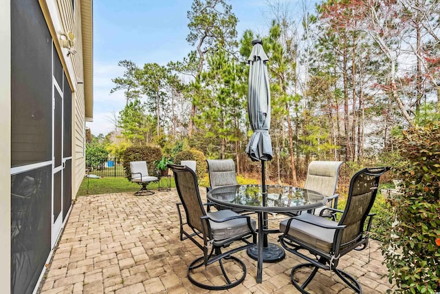 view of patio / terrace featuring fence and outdoor dining space